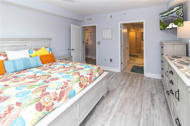 bedroom with light hardwood / wood-style floors