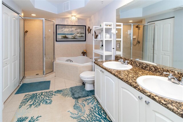 full bathroom featuring vanity, tile patterned floors, plus walk in shower, and toilet