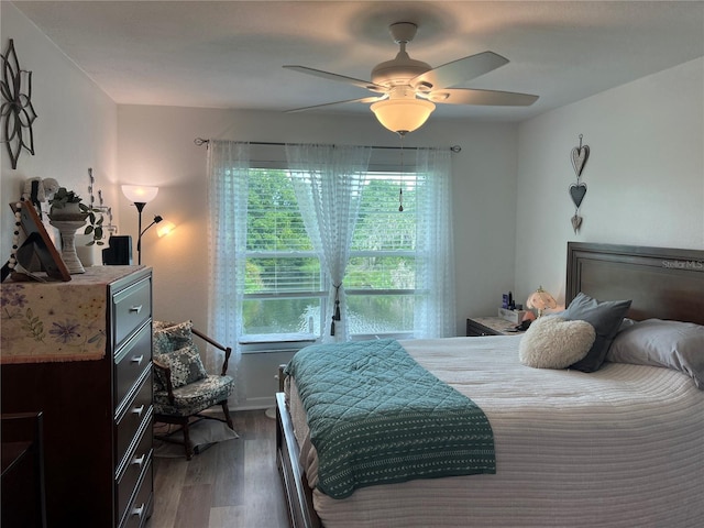 bedroom featuring dark hardwood / wood-style flooring and ceiling fan