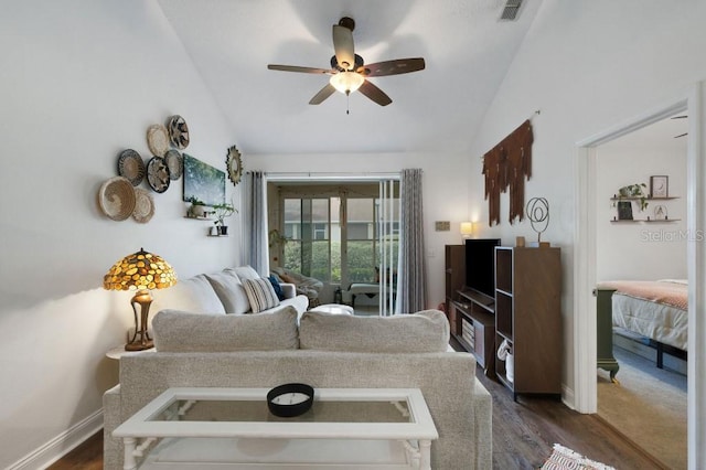 living room with dark wood-type flooring, ceiling fan, and lofted ceiling