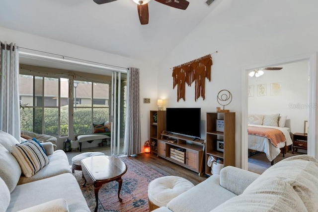 living room featuring ceiling fan, dark hardwood / wood-style flooring, and high vaulted ceiling