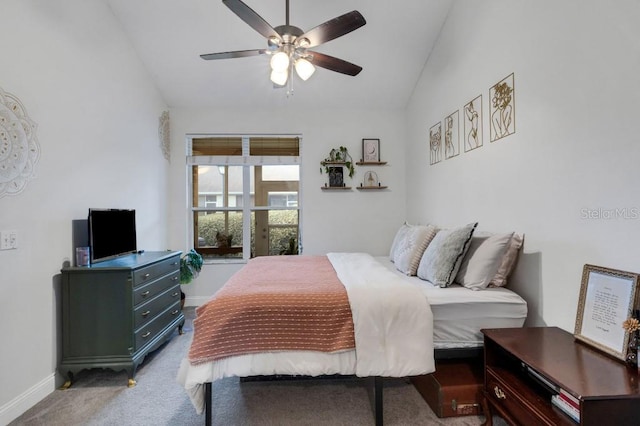 carpeted bedroom featuring ceiling fan and lofted ceiling