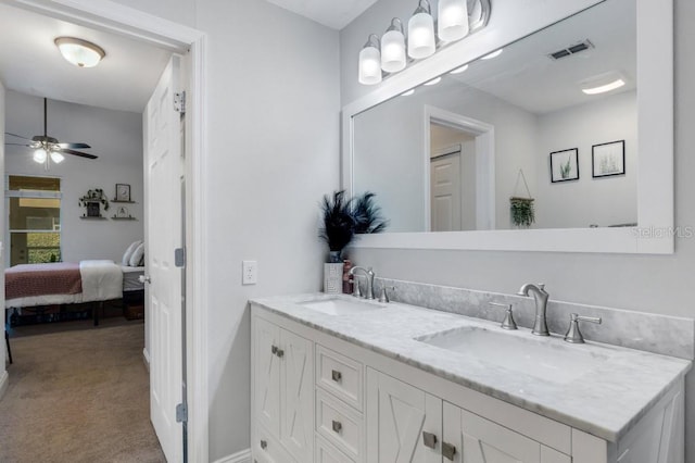 bathroom featuring ceiling fan and vanity