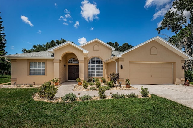 single story home featuring a front lawn and a garage