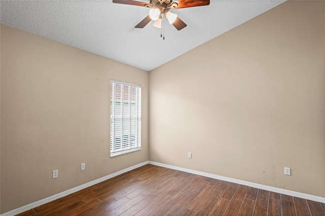 empty room with ceiling fan, dark hardwood / wood-style floors, and a textured ceiling