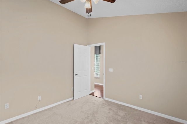 unfurnished room with light carpet and ceiling fan