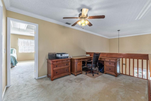 carpeted office space with ceiling fan, ornamental molding, and a textured ceiling