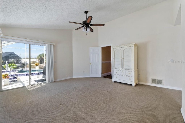 unfurnished bedroom featuring high vaulted ceiling, access to exterior, ceiling fan, light carpet, and a textured ceiling