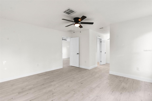 spare room with ceiling fan and light wood-type flooring