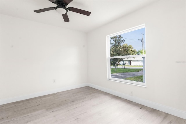 unfurnished room with light wood-type flooring and ceiling fan