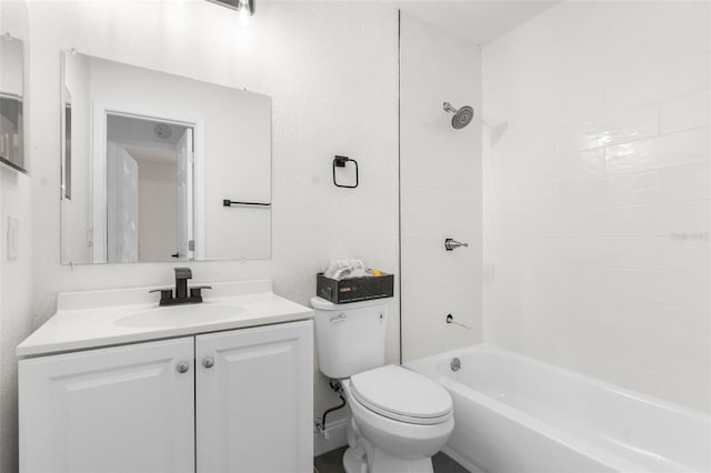 full bathroom with vanity, tiled shower / bath, and toilet