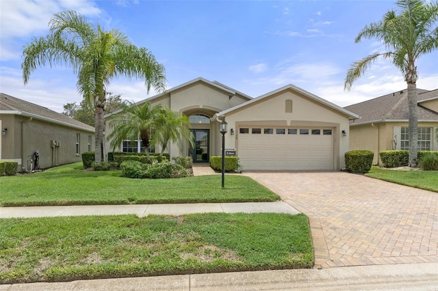 view of front of home featuring a garage and a front yard