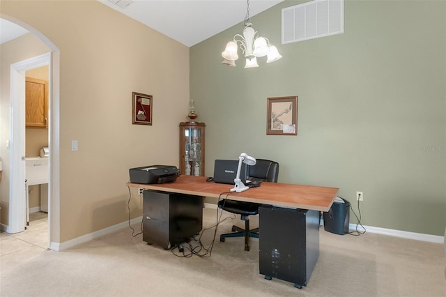 carpeted office featuring vaulted ceiling