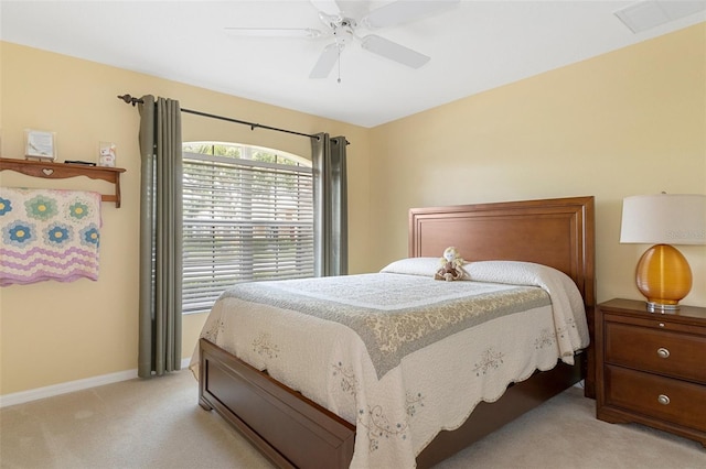 bedroom featuring ceiling fan and light colored carpet