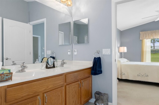 bathroom featuring vanity, vaulted ceiling, and ceiling fan