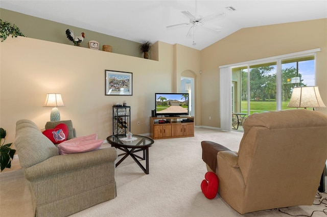 living room with ceiling fan, lofted ceiling, and light carpet