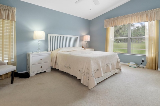 carpeted bedroom with lofted ceiling and ceiling fan