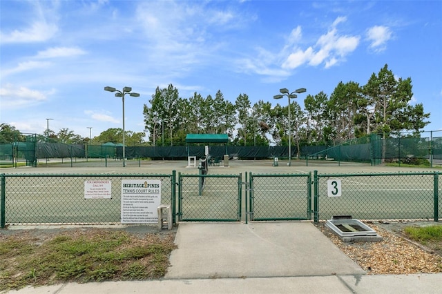 surrounding community with tennis court