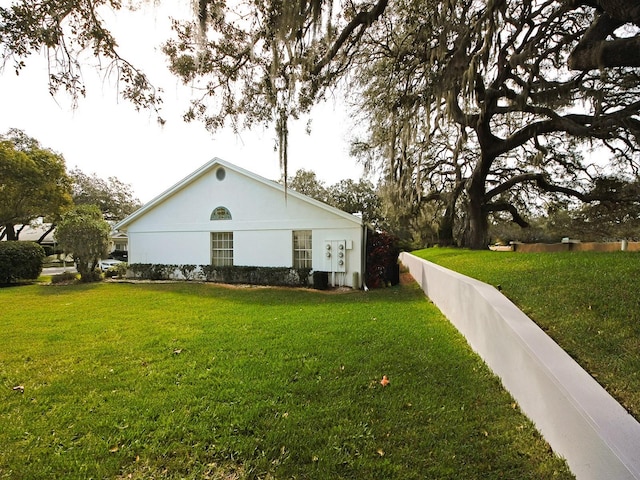 view of home's exterior featuring a yard