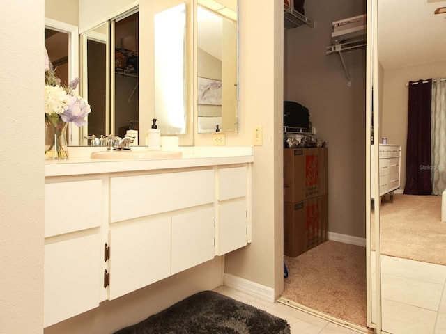 bathroom with tile patterned floors and vanity