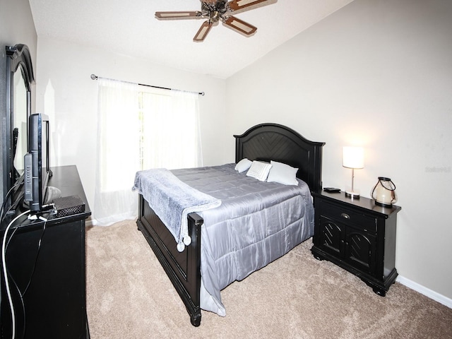 bedroom with ceiling fan, light carpet, and lofted ceiling