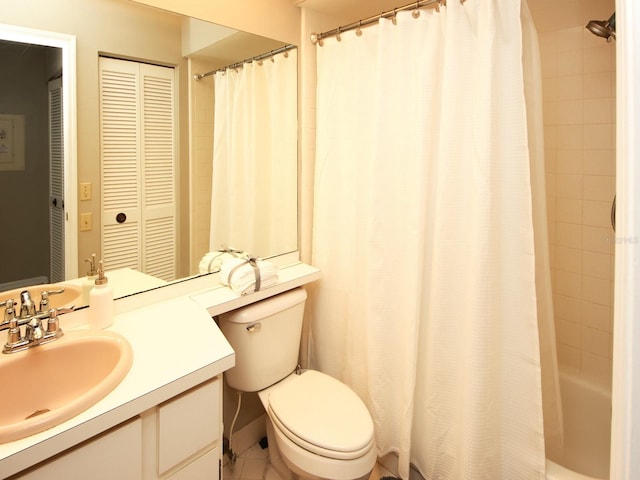 full bathroom featuring tile patterned flooring, vanity, toilet, and shower / tub combo