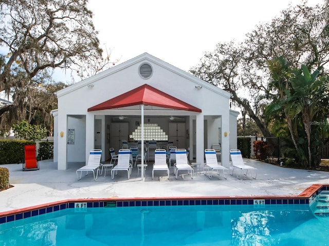 rear view of house featuring a community pool