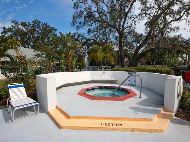 view of pool with a community hot tub