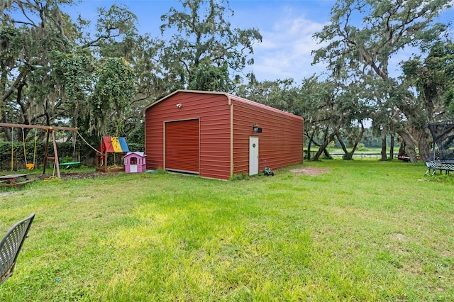 view of yard featuring a playground and an outdoor structure