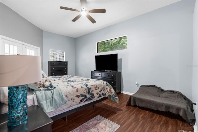 bedroom with ceiling fan and dark wood-type flooring