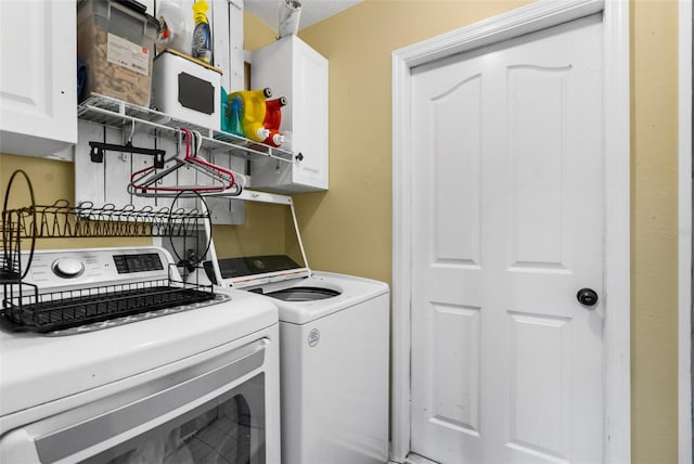 laundry area featuring cabinets and washer and dryer