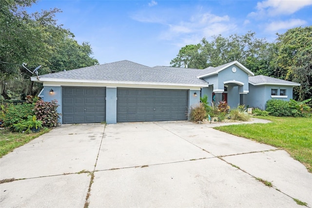 ranch-style house featuring a garage