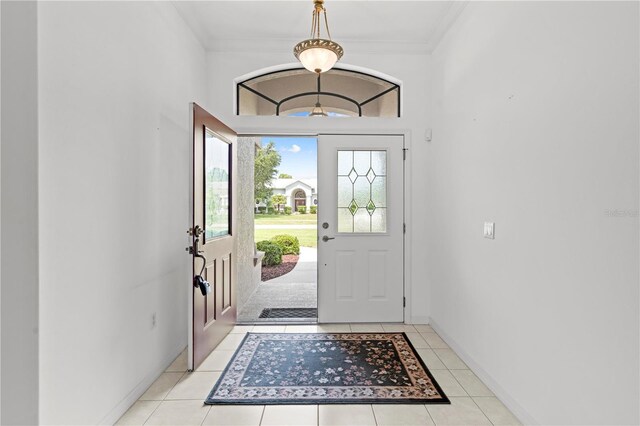 tiled entryway with ornamental molding