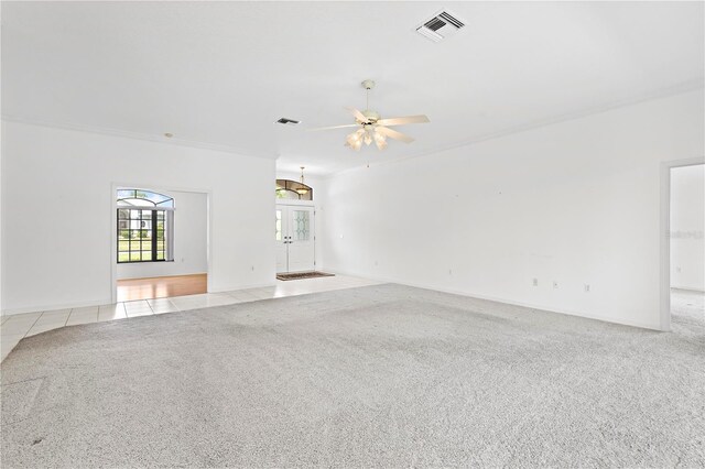 empty room featuring light carpet and ceiling fan