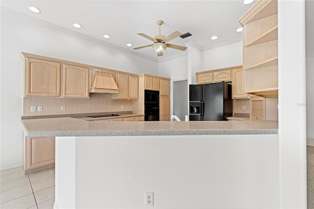 kitchen with custom exhaust hood, light brown cabinetry, kitchen peninsula, black appliances, and tasteful backsplash