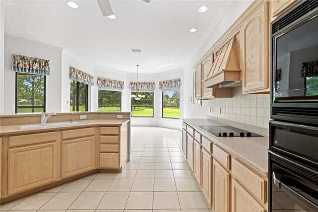 kitchen featuring premium range hood, light tile patterned flooring, tasteful backsplash, black appliances, and light brown cabinets