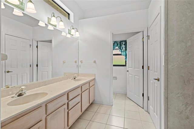 bathroom featuring double sink vanity and tile patterned flooring