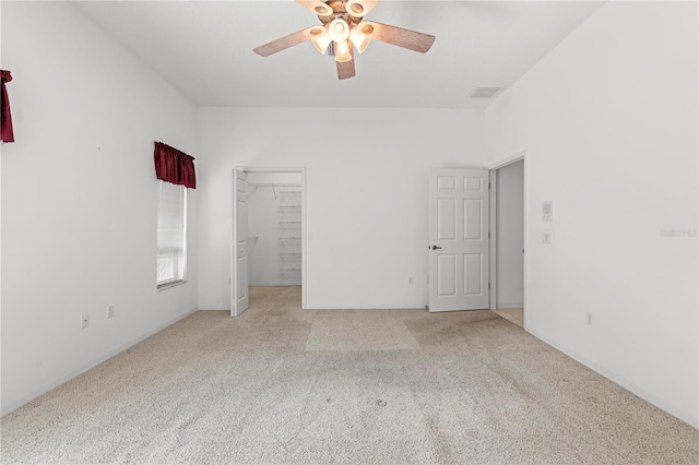 interior space featuring ceiling fan and light colored carpet