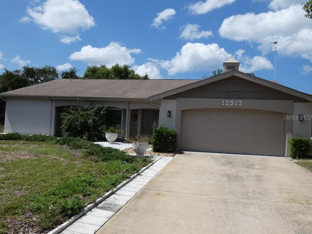 ranch-style house featuring a garage