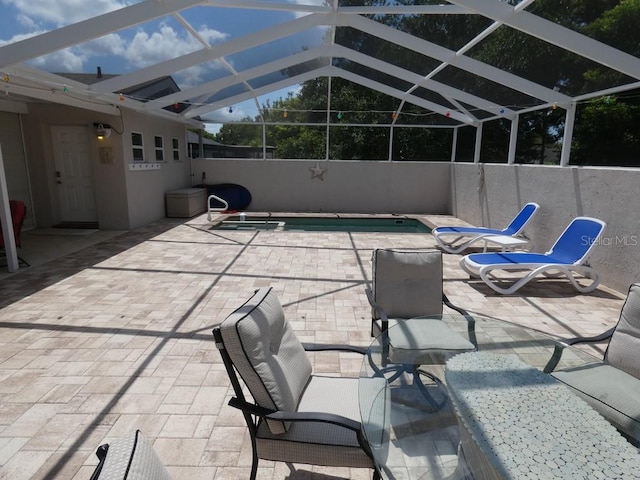 view of patio / terrace with a lanai and a fenced in pool