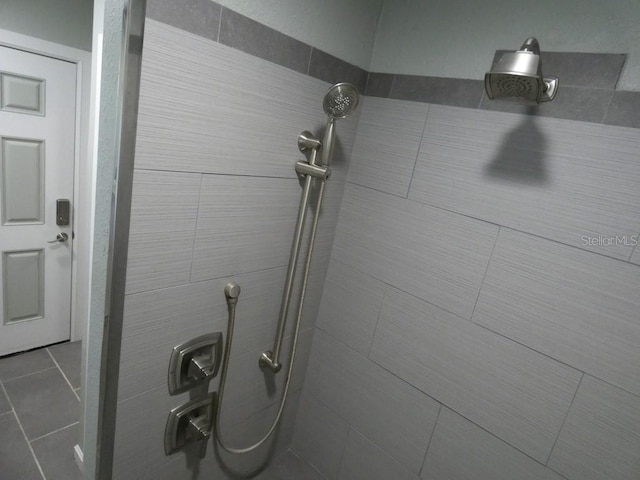 bathroom with a tile shower