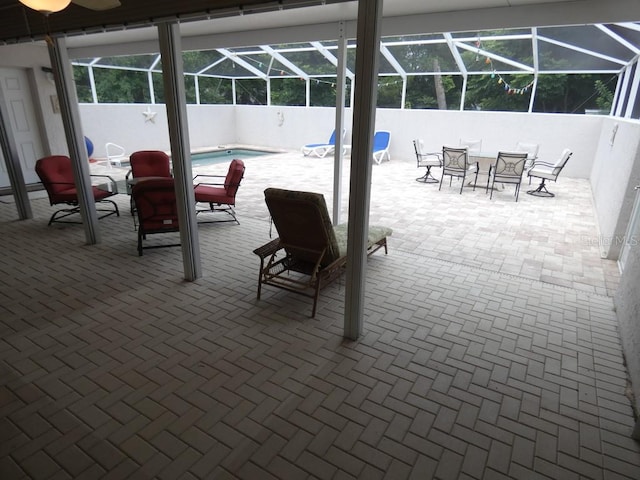 view of patio featuring a lanai and a fenced in pool