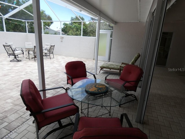 view of patio / terrace with a lanai