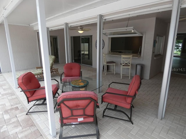 view of patio / terrace featuring ceiling fan