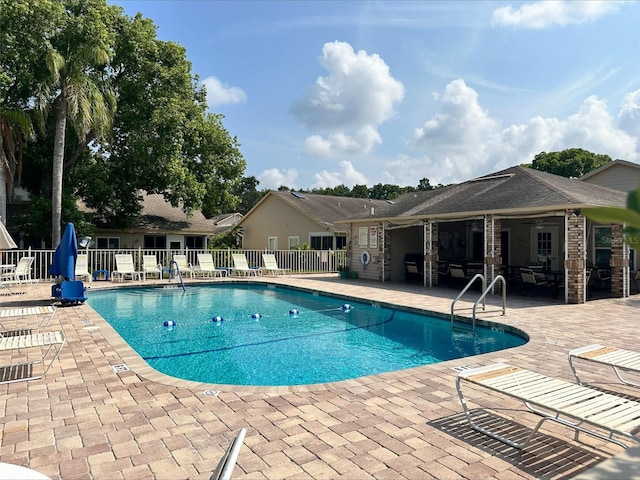 view of swimming pool featuring a patio