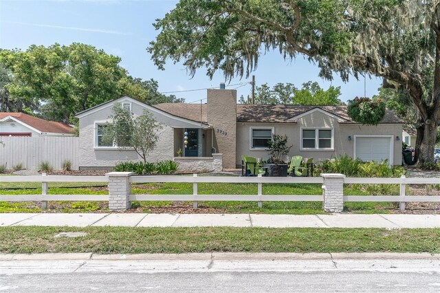 view of front of property with a garage