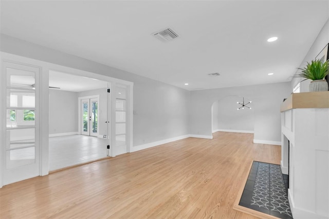 unfurnished living room featuring light wood-type flooring