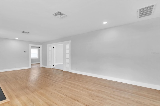 unfurnished room featuring light hardwood / wood-style floors