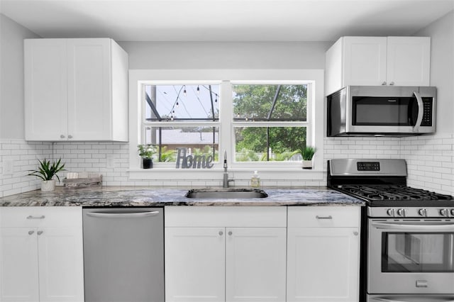 kitchen with white cabinetry and appliances with stainless steel finishes