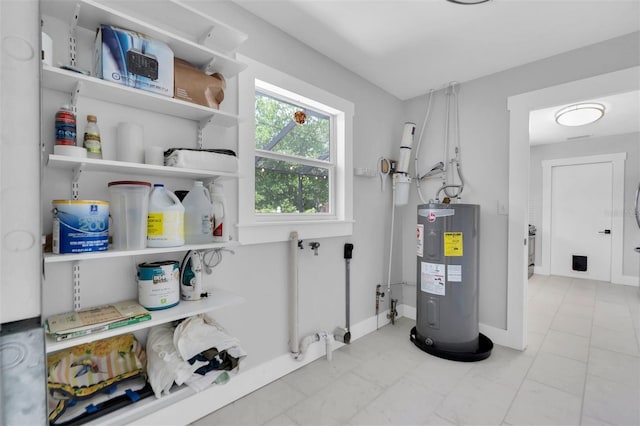 utility room featuring electric water heater